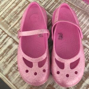Pink sparkly crocs